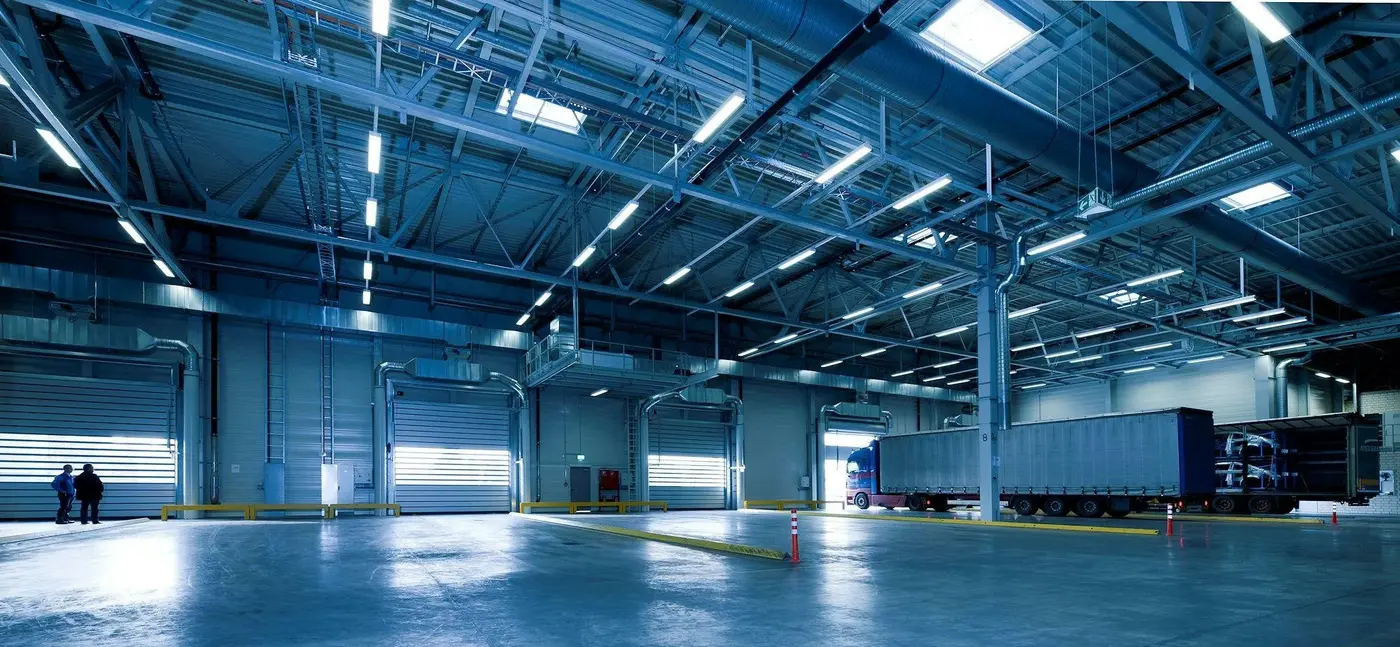 Distribution warehouse with high-bay lights above the dock doors